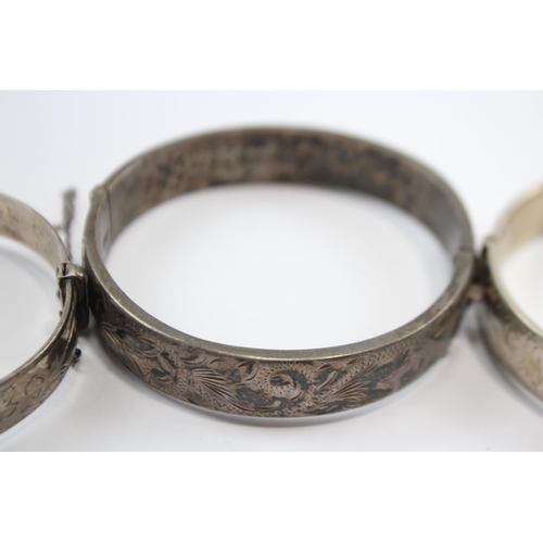 237 - A Collection Of Silver Bangles With Engraved Designs