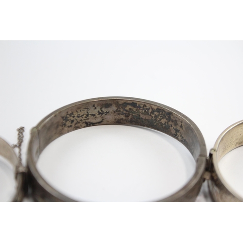 237 - A Collection Of Silver Bangles With Engraved Designs