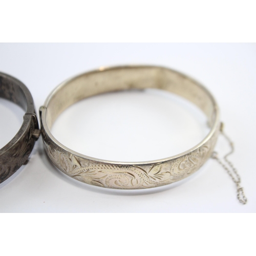 237 - A Collection Of Silver Bangles With Engraved Designs