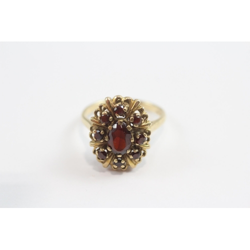 93 - 9ct Gold Garnet Halo Ring (3.5g) Size  J