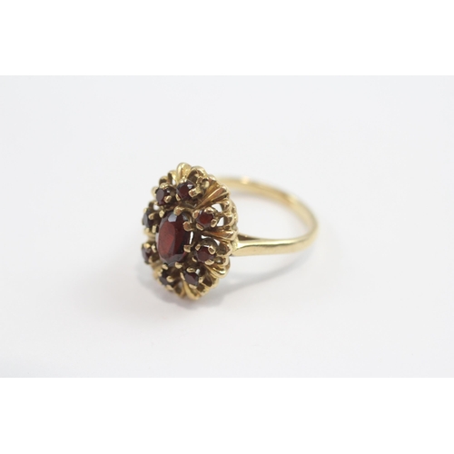 93 - 9ct Gold Garnet Halo Ring (3.5g) Size  J