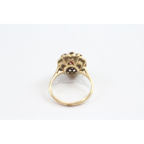 93 - 9ct Gold Garnet Halo Ring (3.5g) Size  J