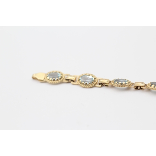 29 - 9ct Gold Blue Topaz Bracelet (7.4g)