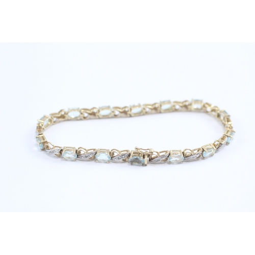 69 - 9ct Gold Diamond & Blue Topaz Fancy Link Bracelet (8.7g)