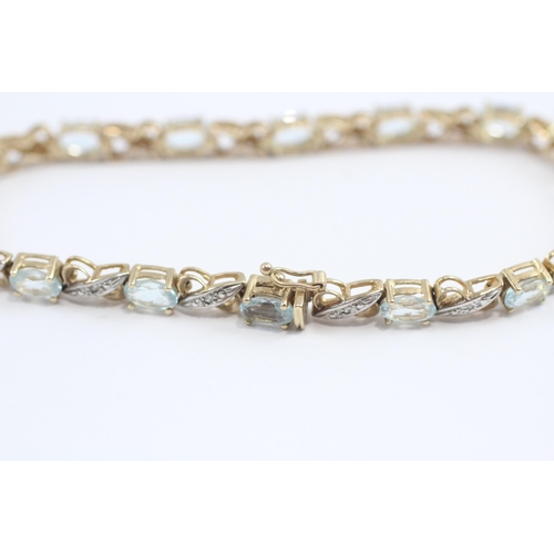 69 - 9ct Gold Diamond & Blue Topaz Fancy Link Bracelet (8.7g)