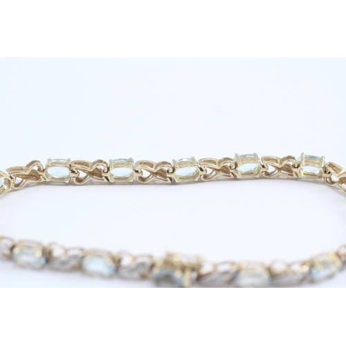 69 - 9ct Gold Diamond & Blue Topaz Fancy Link Bracelet (8.7g)