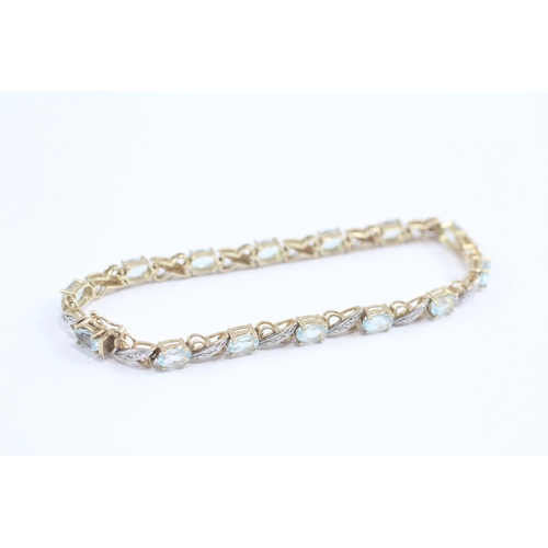 69 - 9ct Gold Diamond & Blue Topaz Fancy Link Bracelet (8.7g)