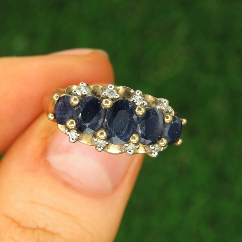 123 - 9ct Gold Sapphire Five Stone Ring With Diamond Accent (3g) Size  L