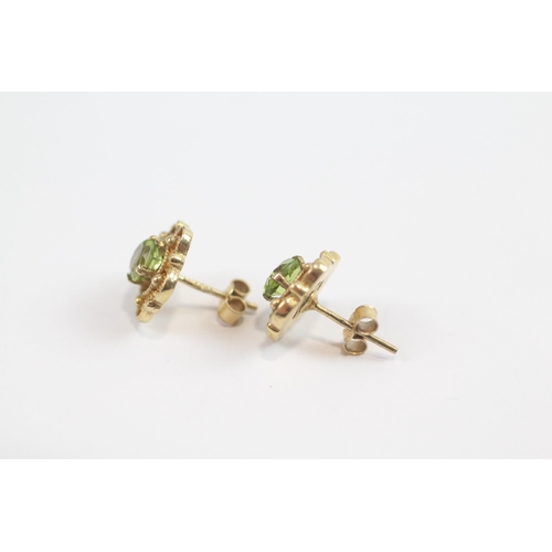 105 - 9ct Gold Peridot Set Floral Stud Earrings (2.9g)