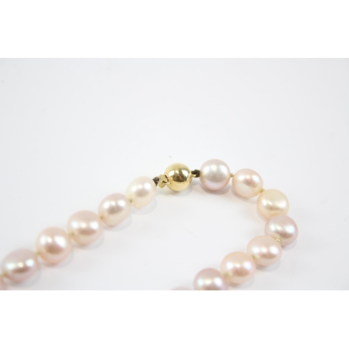 127 - 18ct Gold Clasped Pink Cultured Button Pearl Necklace (38.9g)