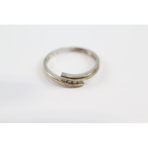 134 - 9ct Gold Diamond Four Stone Bypass Ring (1.5g) Size  L