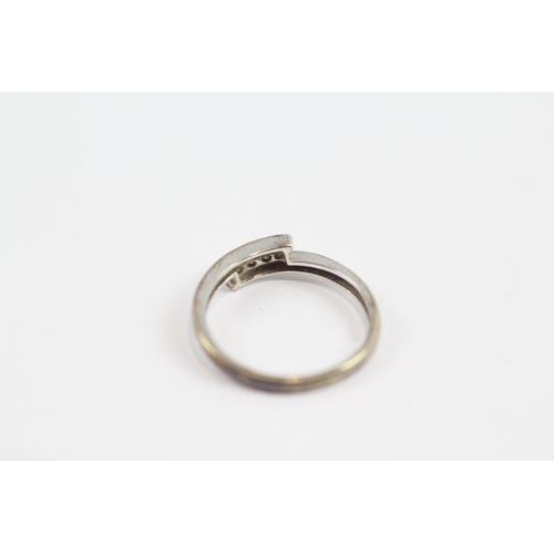 134 - 9ct Gold Diamond Four Stone Bypass Ring (1.5g) Size  L