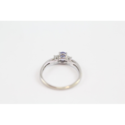 149 - 9ct White Gold Diamond & Tanzanite Three Stone Ring (1.2G) Size  L