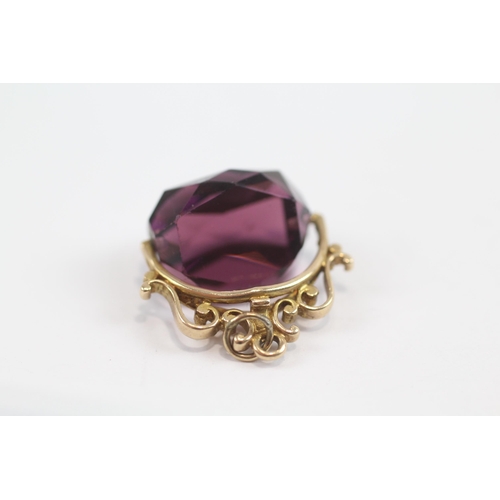 170 - 9ct Gold Vintage Amethyst Coloured Glass Spinning Fob (6.1g)