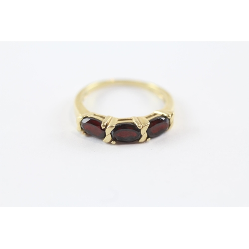 243 - 14ct Gold Garnet Three Stone Ring (2.4g) Size  L 1/2
