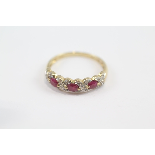 63 - 9ct Gold Ruby Three Stone Ring With Diamond Surround (2.1g) Size  R