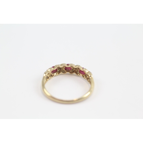 63 - 9ct Gold Ruby Three Stone Ring With Diamond Surround (2.1g) Size  R