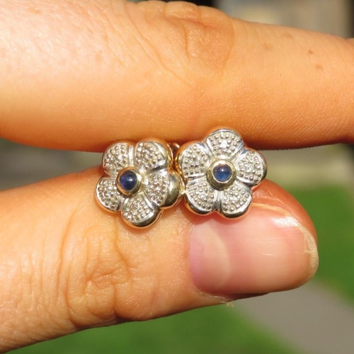 104 - 9ct Gold Diamond And Cabochon Sapphire Set Flower Stud Earrings (3.3g)