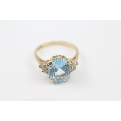 115 - 9ct Gold Blue Topaz & Cubic Zirconia Dress Ring (3.4g) Size  O