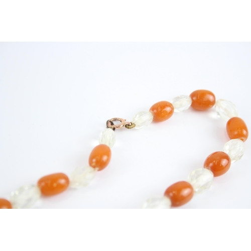 198 - 9ct Gold Clasp Antique Butterscotch Amber & Paste Single Strand Necklace (33.3g)