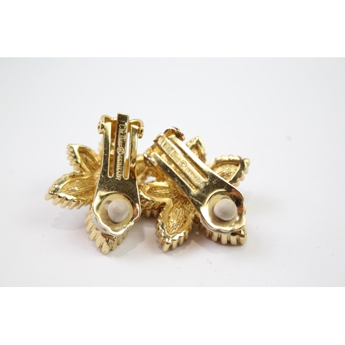 215 - A pair of gold tone clip on earrings by designer Christian Dior (16g)