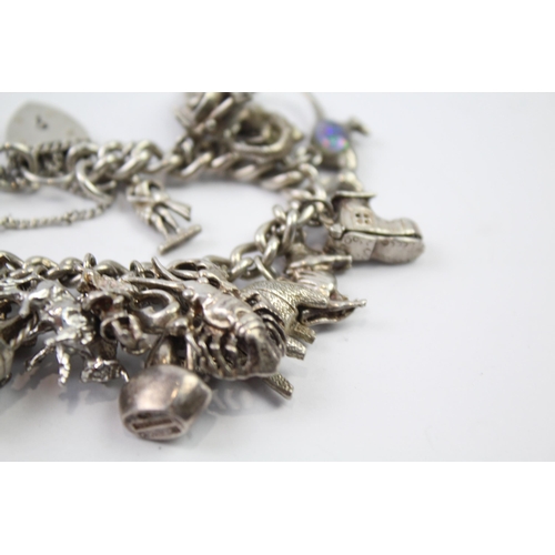 217 - Silver charm bracelet with heart padlock clasp (83g)