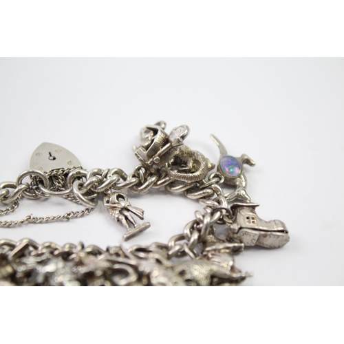 217 - Silver charm bracelet with heart padlock clasp (83g)