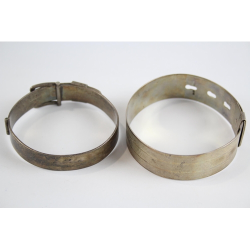 231 - Two silver buckle design bangles (63g)