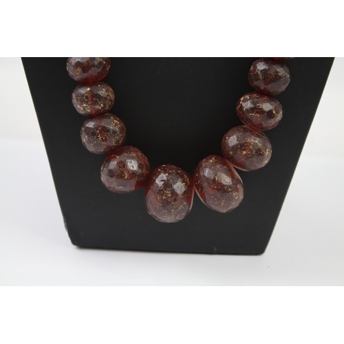 243 - Antique faceted Amber graduated necklace (91g)