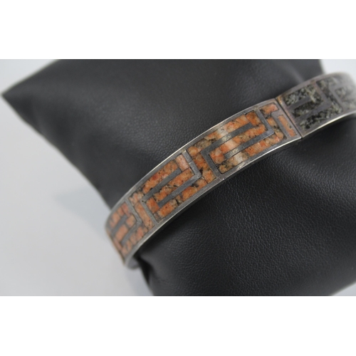 257 - Silver antique granite inlay bangle by M Rettie and Sons (48g)