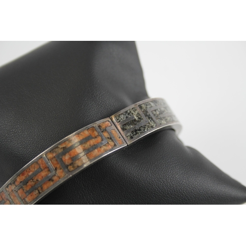 257 - Silver antique granite inlay bangle by M Rettie and Sons (48g)