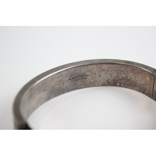 257 - Silver antique granite inlay bangle by M Rettie and Sons (48g)