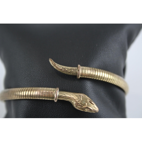 260 - 9ct rolled gold wrap around snake bangle (17g)