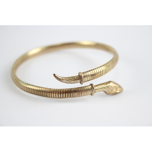 260 - 9ct rolled gold wrap around snake bangle (17g)