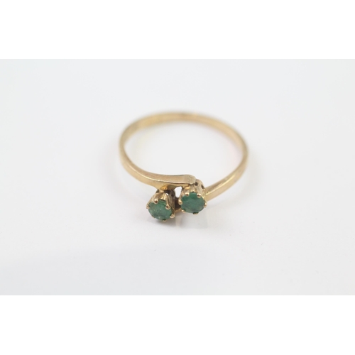 73 - 9ct Gold Emerald Two Stone Bypass Ring (1.4g) Size  M