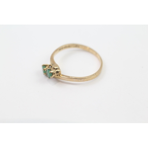 73 - 9ct Gold Emerald Two Stone Bypass Ring (1.4g) Size  M