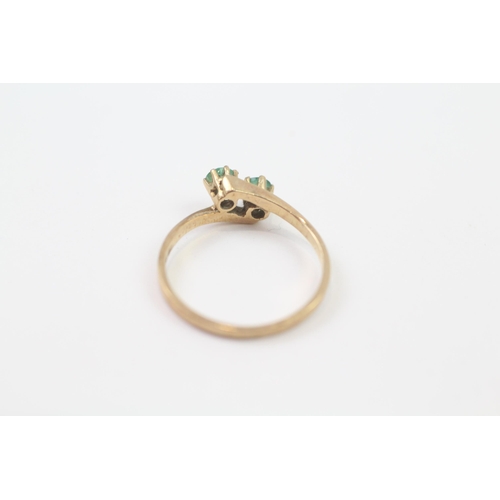 73 - 9ct Gold Emerald Two Stone Bypass Ring (1.4g) Size  M