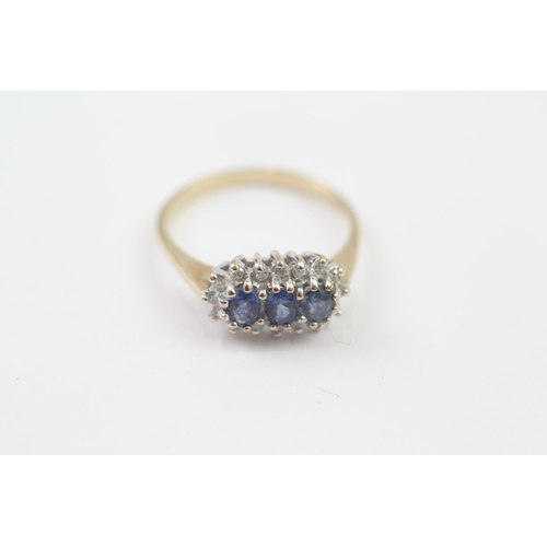 74 - 9ct Gold Sapphire Three Stone Ring With Diamond Surround (2.5g) Size  P