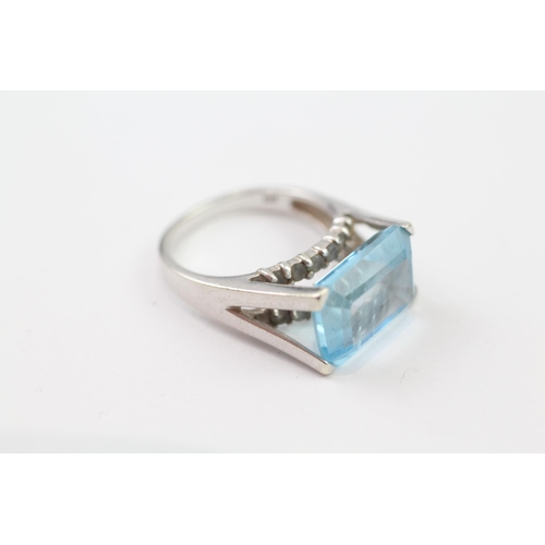 137 - 9ct White Gold Blue Topaz Cocktail Ring (6.1g) Size  M