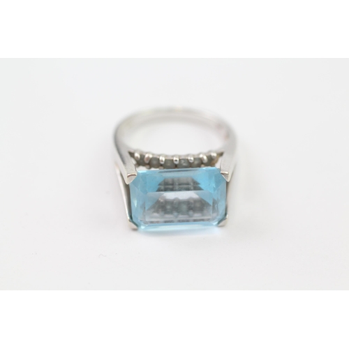 137 - 9ct White Gold Blue Topaz Cocktail Ring (6.1g) Size  M