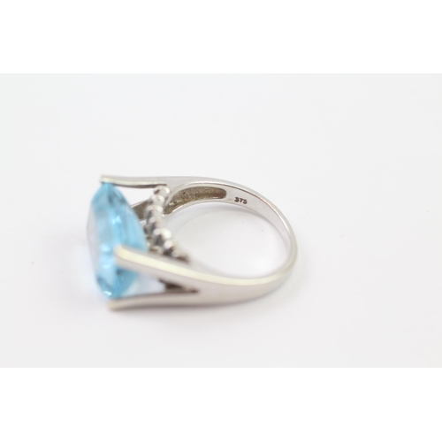 137 - 9ct White Gold Blue Topaz Cocktail Ring (6.1g) Size  M