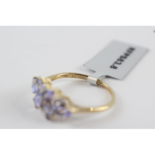 206 - 9ct gold tanzanite & diamond floral dress ring (2.4g) Size  P 1/2