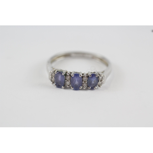 207 - 9ct white gold tanzanite & diamond trilogy ring (2g) Size  P