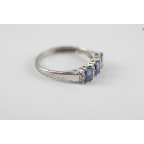 207 - 9ct white gold tanzanite & diamond trilogy ring (2g) Size  P