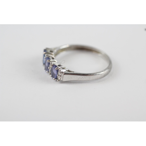 207 - 9ct white gold tanzanite & diamond trilogy ring (2g) Size  P