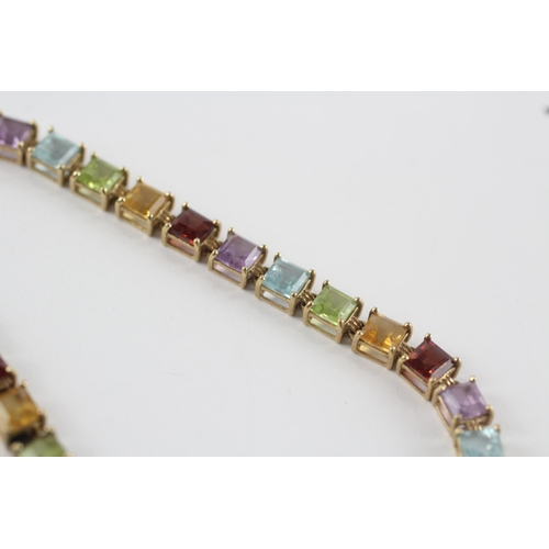 218 - 9ct gold amethyst, topaz, peridot, citrine & garnet tennis bracelet (7.4g)