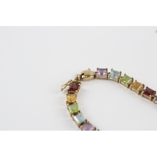 218 - 9ct gold amethyst, topaz, peridot, citrine & garnet tennis bracelet (7.4g)