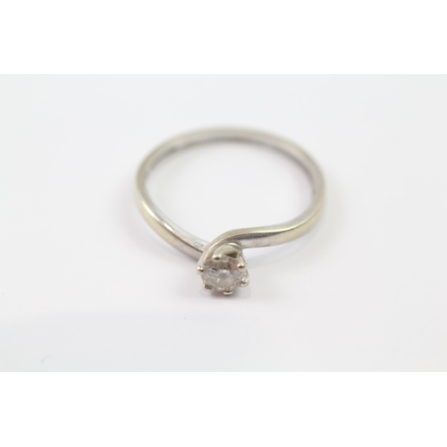 242 - 9ct white gold vintage twist set diamond solitaire ring (2g) Size  O