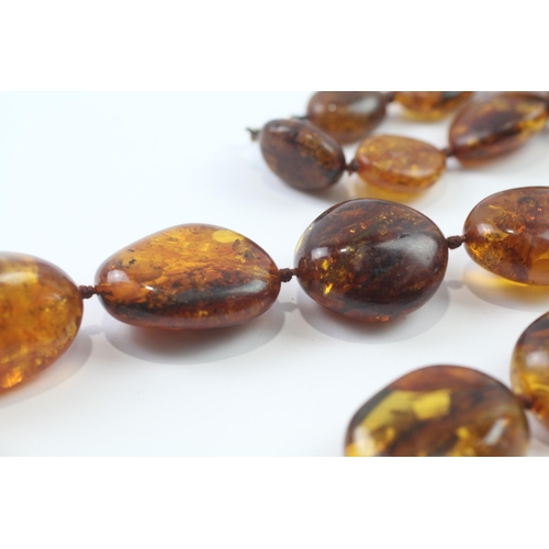 246 - 9ct gold clasped baltic amber bead necklace (99.7g)