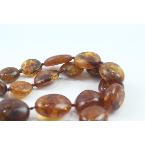 246 - 9ct gold clasped baltic amber bead necklace (99.7g)